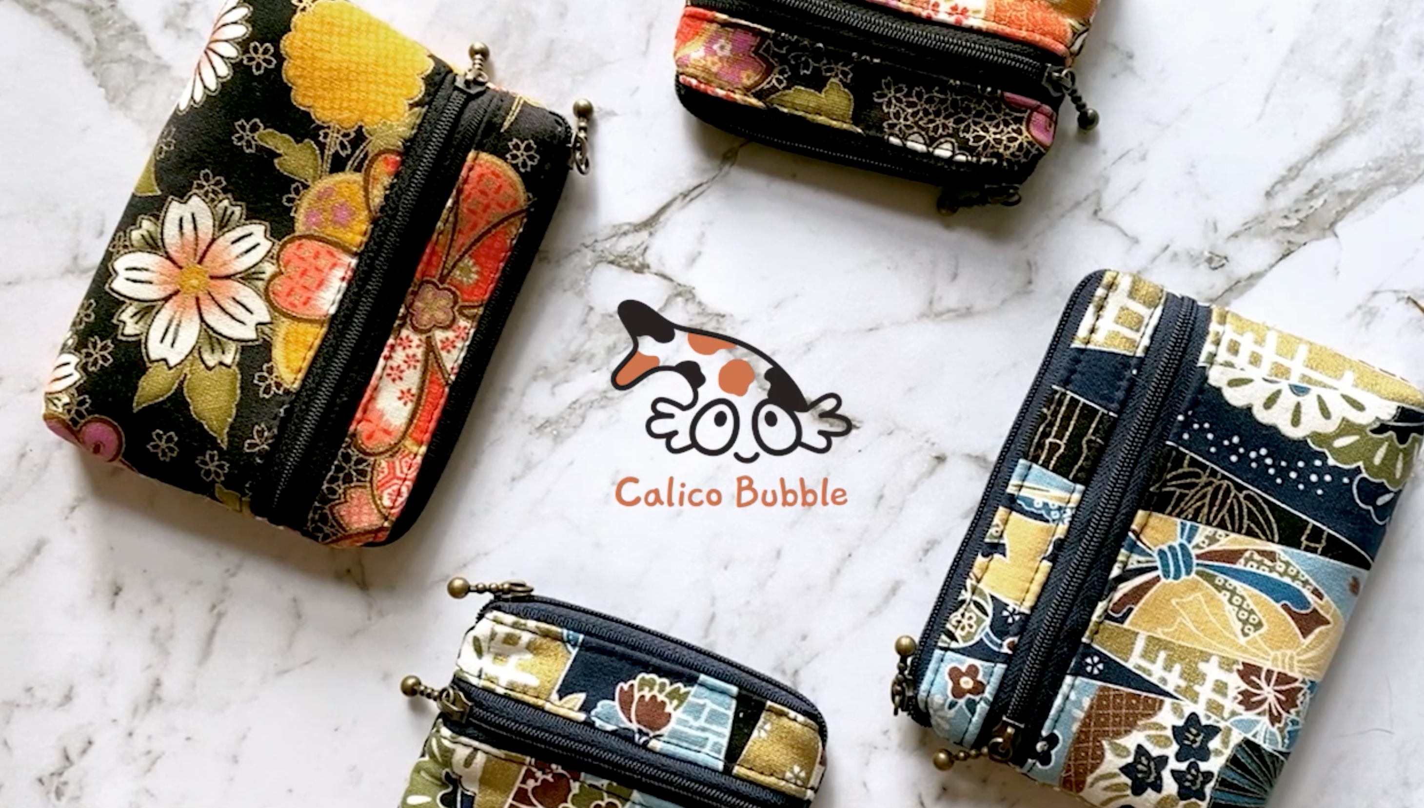Load video: Calico Bubble Everything Pouch